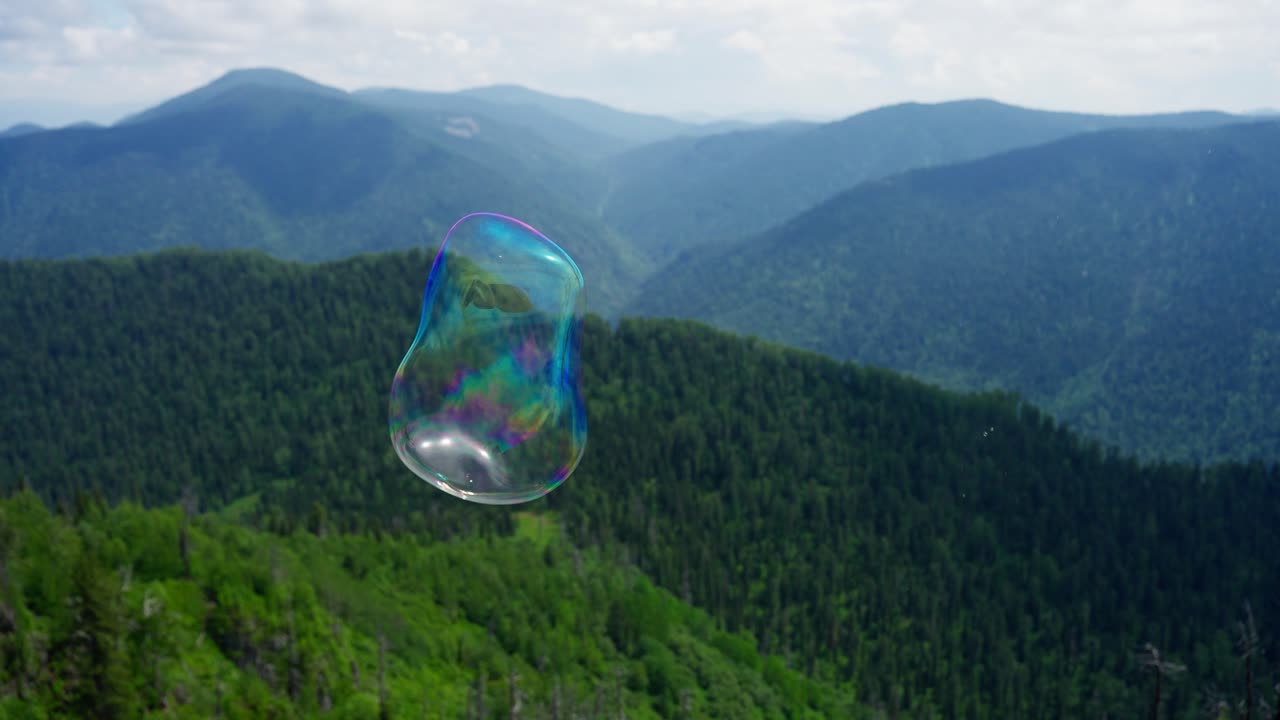 Soap Bubble Over Mountains