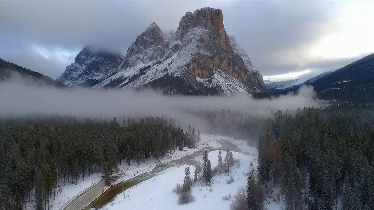 A Serene Winter Landscape Capturing Majestic Mountains, Snow-Covered Valleys, and Enveloping Mist in an Idyllic Natural Setting