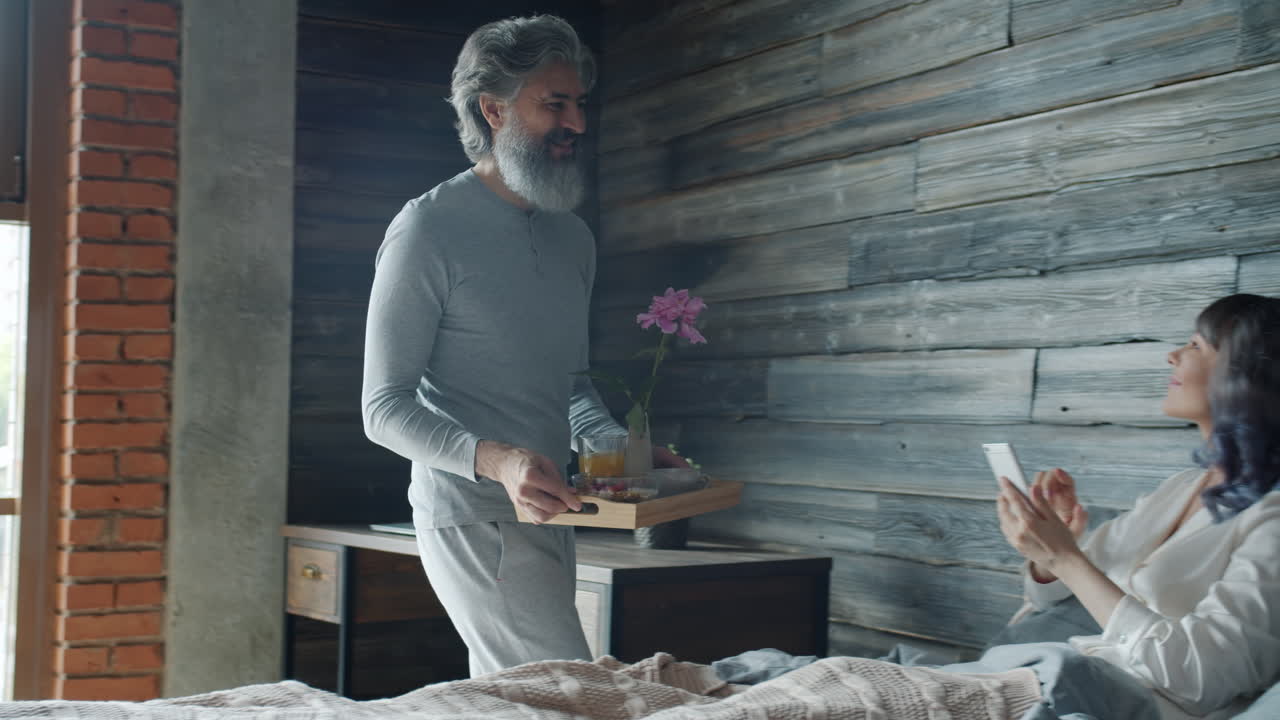 Couple Enjoying Breakfast in Bed