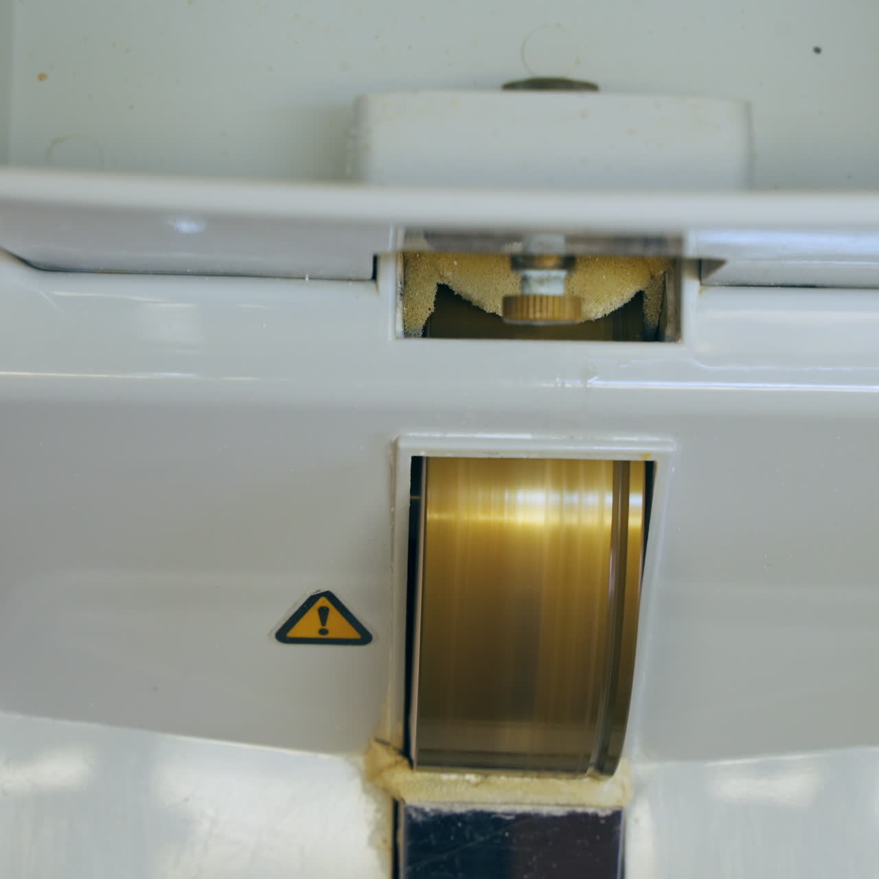 Optician making new lens for eyeglasses. Special equipment for glasses production in the lab. Close-up.