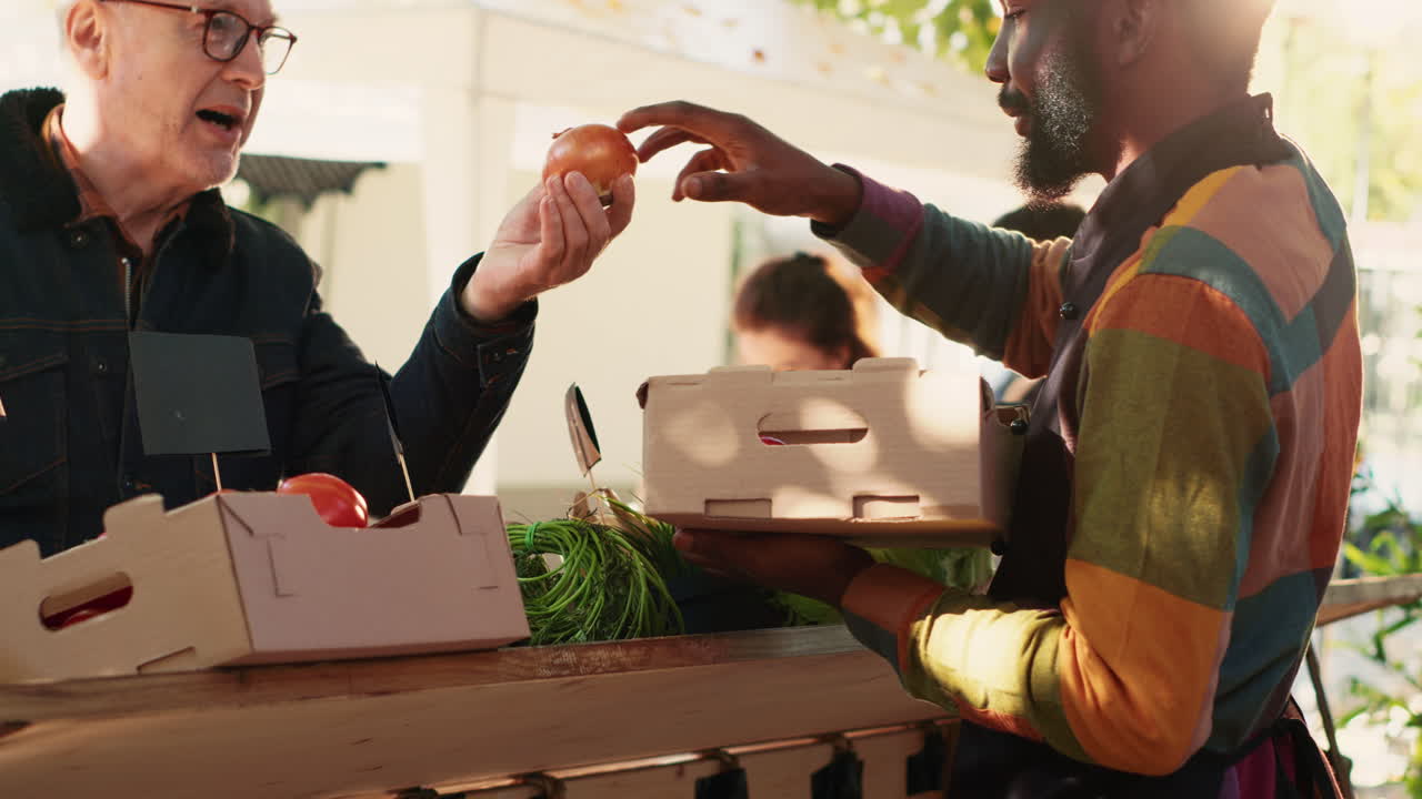 People buying produce at a farmer's market