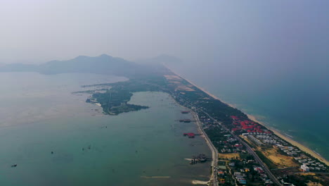 scenic high aerial view flying over the coast of hoi an, vietnam