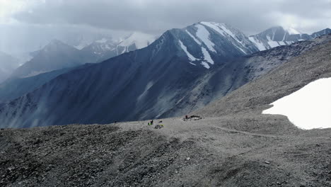 hikers and camp in a high altitude mountain landscape