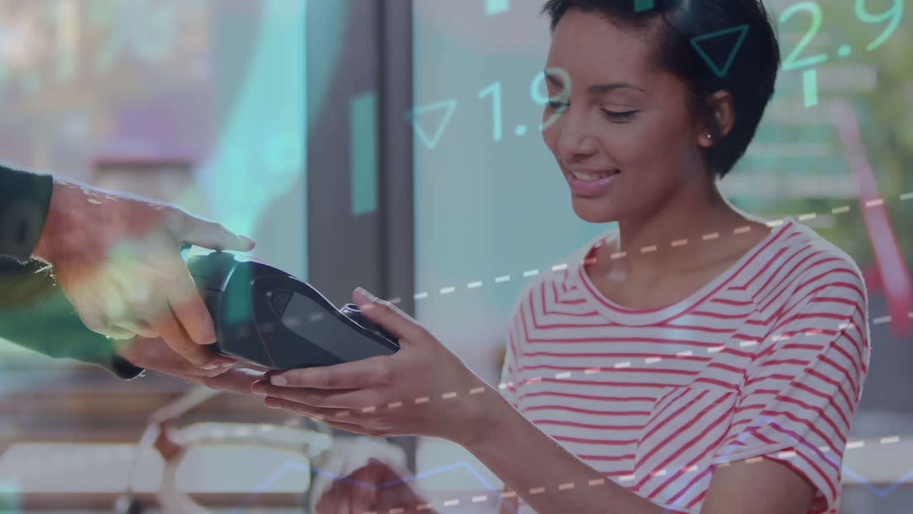Animation of financial data processing over biracial woman paying at payment terminal