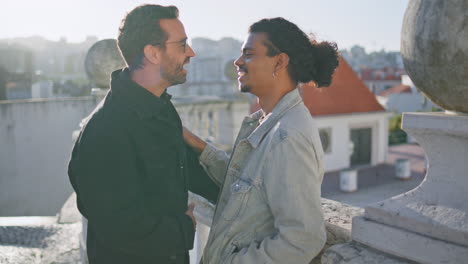 two men on a rooftop balcony