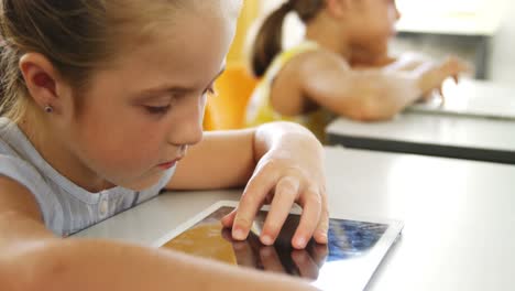 Girl-using-digital-tablet-in-classroom