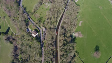 A-Narrow-Boat-Crossing-the-Pontcysyllte-Aqueduct-famously-designed-by-Thomas-Telford,-located-in-the-beautiful-Welsh-countryside,-famous-canal-route