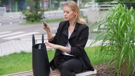 businesswoman using a smartphone outdoors