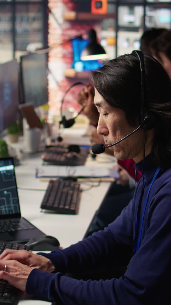 Vertical video Call center agents track shipments in office using AI chatbot for help