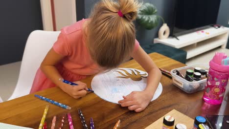 girl drawing at a table