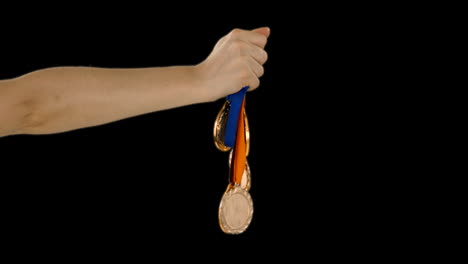 -Hands-throwing-some-medals-