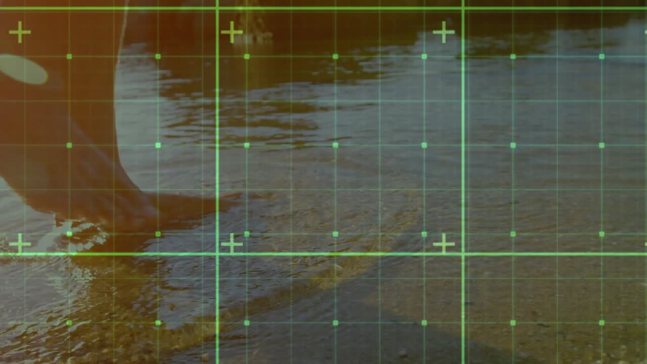 Man shifting weight stepping into shallow surf for technology visualization with green grid overlay