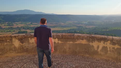 back view of man admiring panorama from penna in teverina belvedere