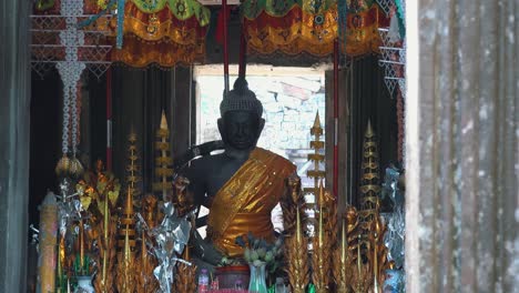 tilt up of buddha statue inside temple