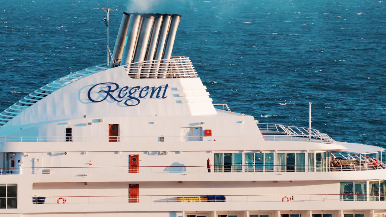 Monte Carlo, Monaco - October 14, 2024: Large cruise ship docked in the Monaco Marina in the evening