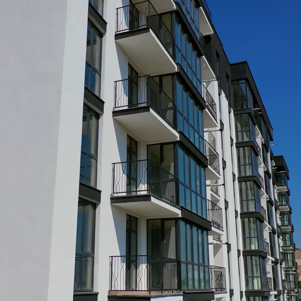 New apartment house. Detailed video on balconies of freshly built high-rise buildings. Dron video.