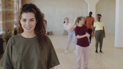 portrait of beautiful brunette woman in dance class