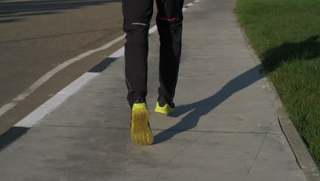 person running on sidewalk