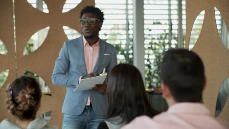 smiling consultant communicating with young workers