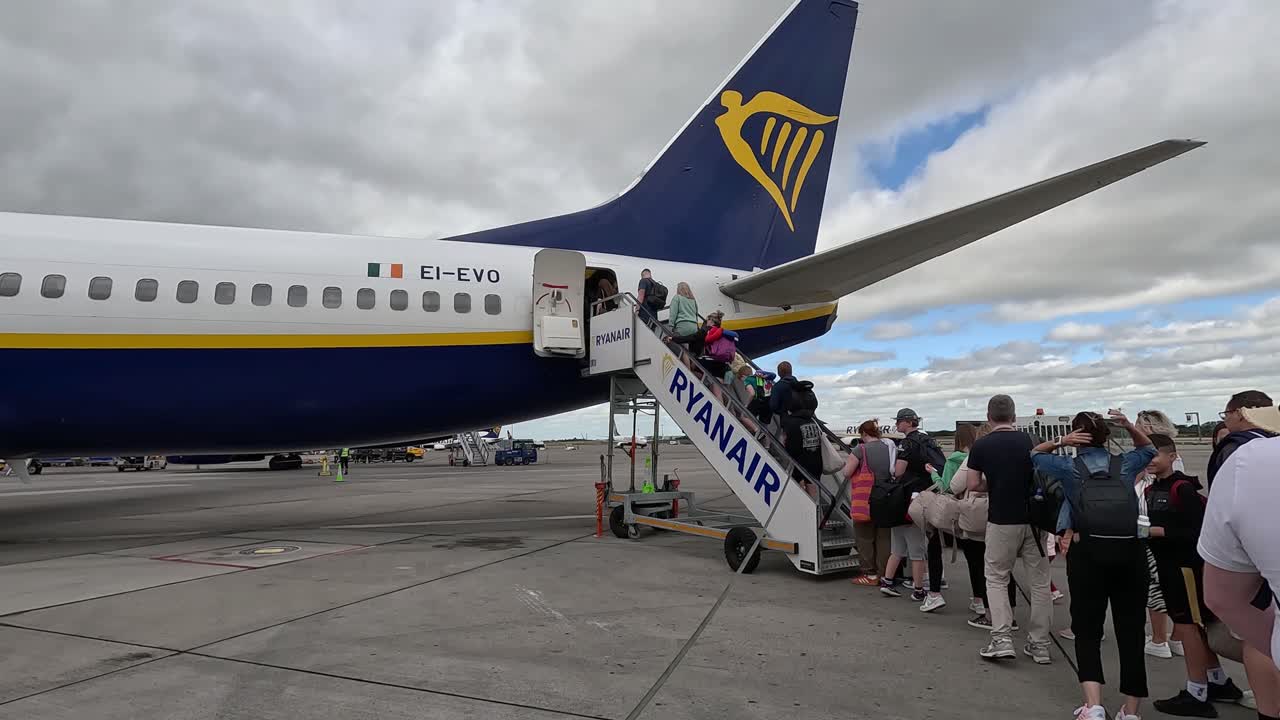 Travelers Boarding the Plane to Embark on Their Dream Vacations From Dublin, Ireland - Medium Shot