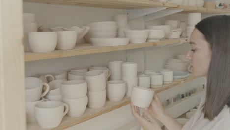 a female ceramicist in her pottery studio