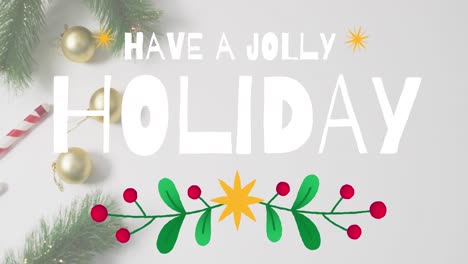 Animation-of-have-a-jolly-holiday-text-banner-against-christmas-decorations-on-grey-surface