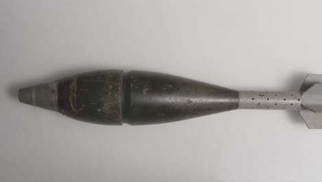 mortar shell on white surface