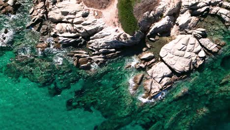 Ovehead-clip-over-an-exotic-beach-in-Vourvourou,-Haklidikin-in-northern-Greece-on-a-clear-summer-day