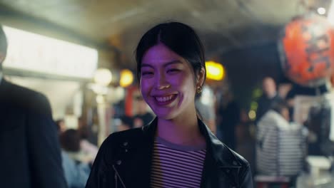 smiling asian woman at night market