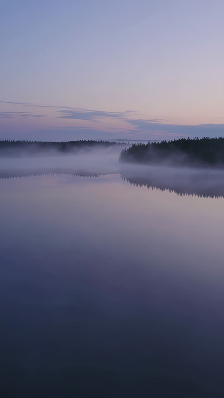 Misty Sunrise/Sunset over a Calm Lake