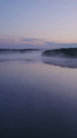 misty sunrise/sunset over a calm lake