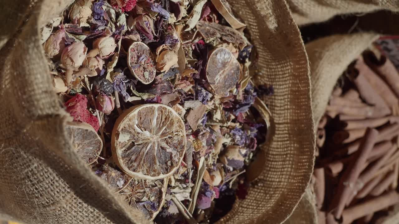 Aromatic Dried Flowers, Herbs, and Spices in Burlap Bags