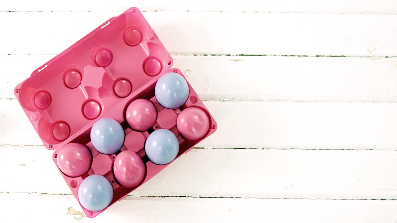 Multicolored Easter eggs in the carton