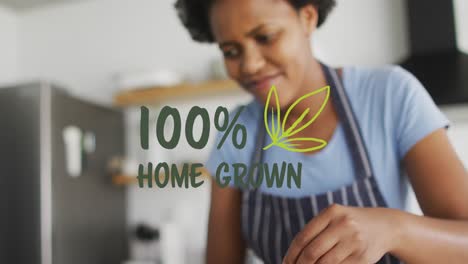 Animation-of-100-percentile-home-grown-text-over-african-american-woman-cutting-plant-at-home