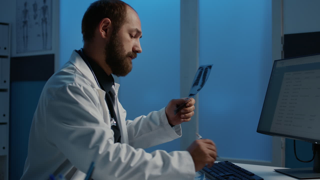 Doctor Examines X-Ray in Office