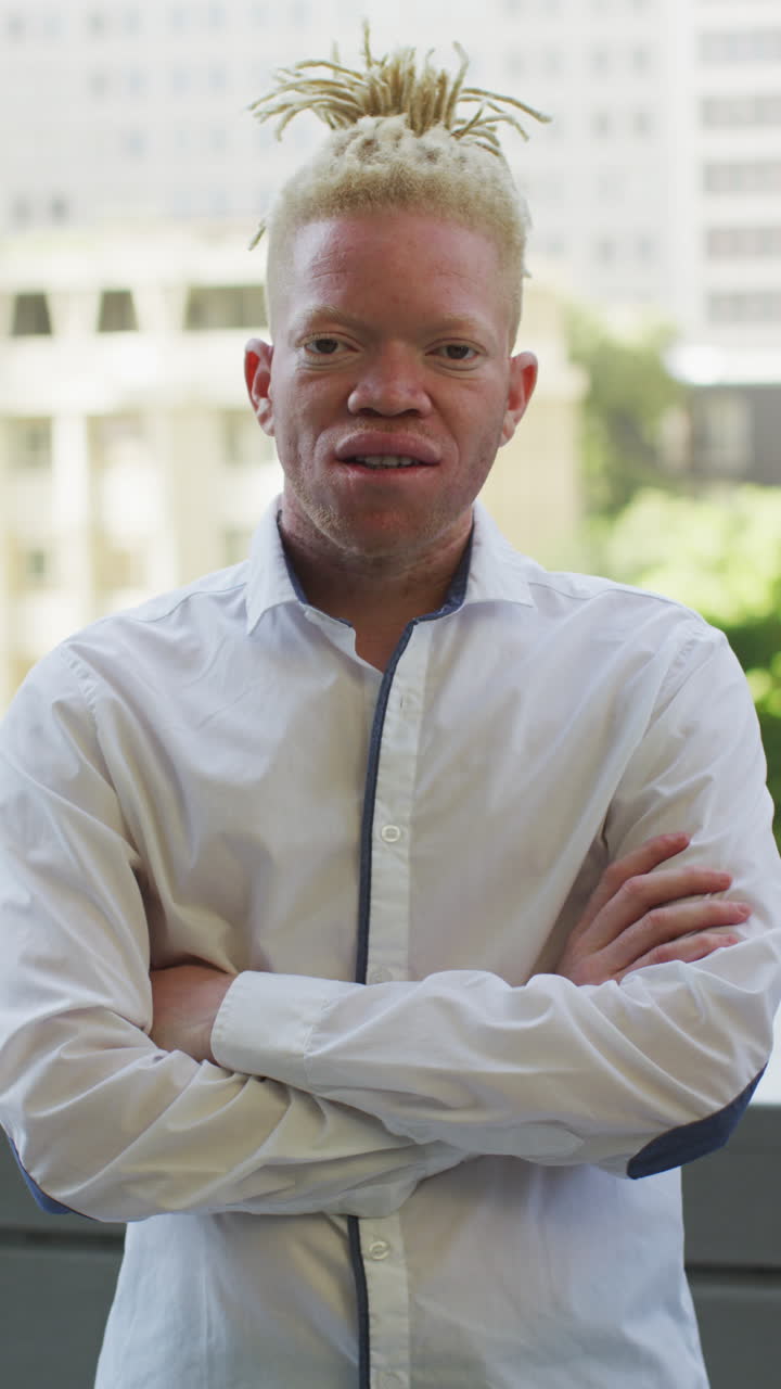 Vertical video of portrait of albino african american businessman