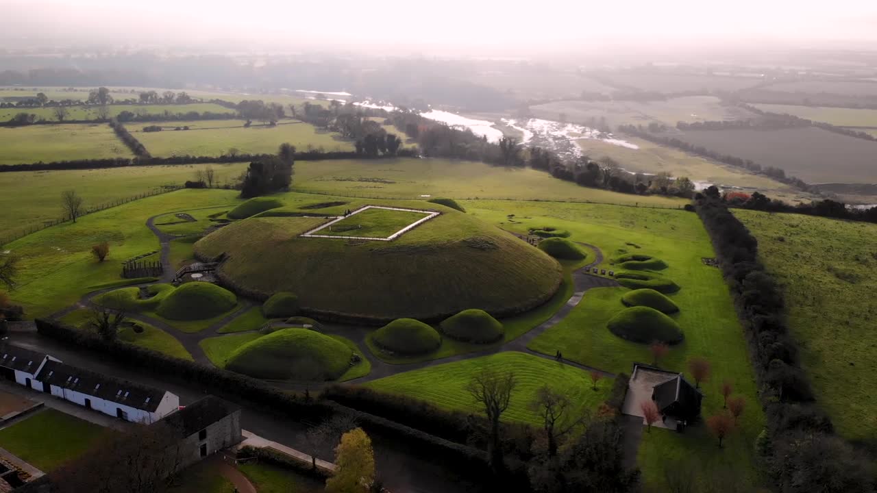Meghalitic neolitic tomb Knowth aerial orbit shot. Complex located near by Newgrange, River Boyne valley, Ireland.