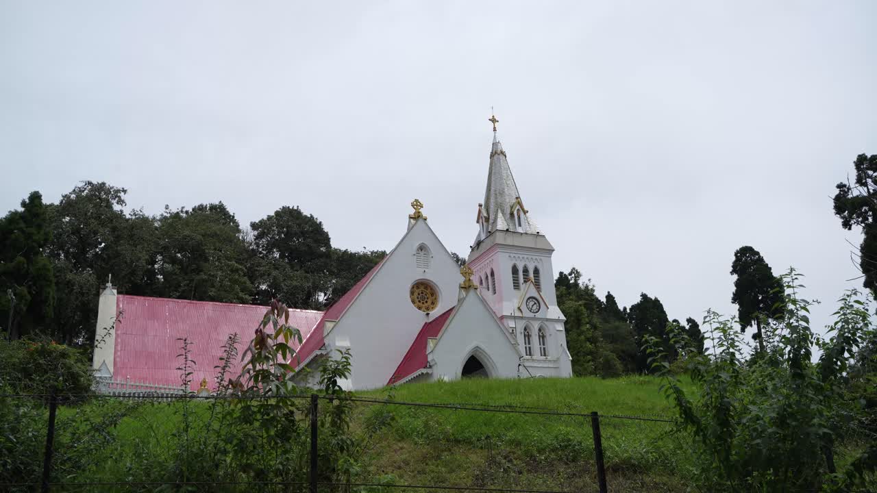 There is a church on the top of the mountain. It is located in Darjeeling