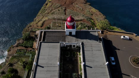 &quot;panoramic views of madeira island from ponta do pargo lighthouse - a shot that shows the lighthouse and the surrounding landscape of the island from a high perspective