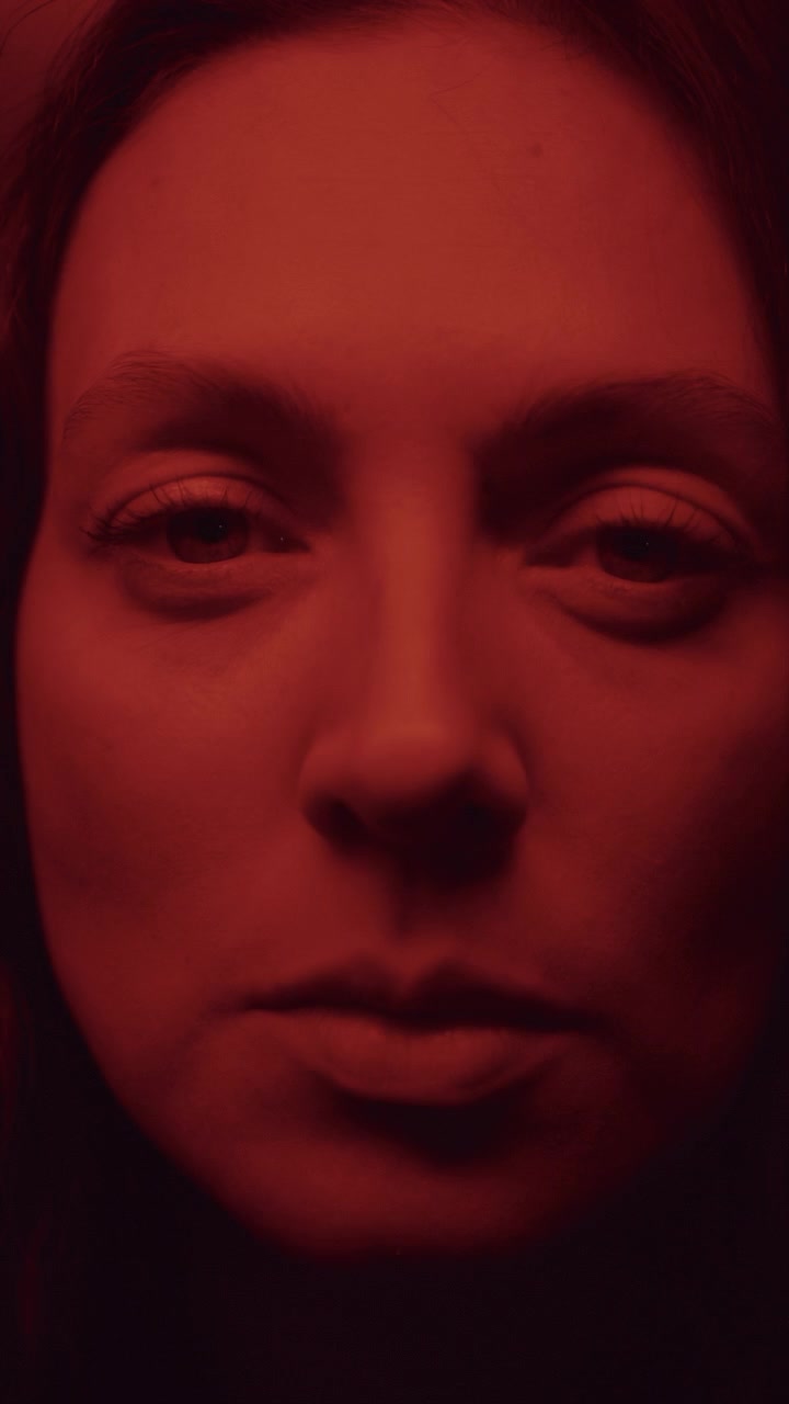 Abstract Prism Portrait of Womans Face in Intense Red Light
