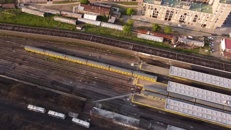 yellow train arriving at federico lacroze station in buenos aires