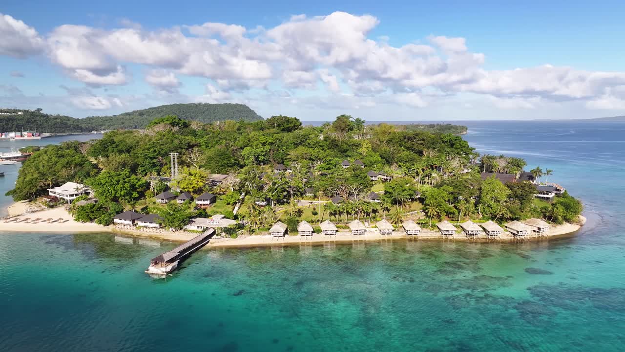Amazing leisure holiday in Pacific. Iririki Island resort with sandy beach and lush tropical vegetation. Drone