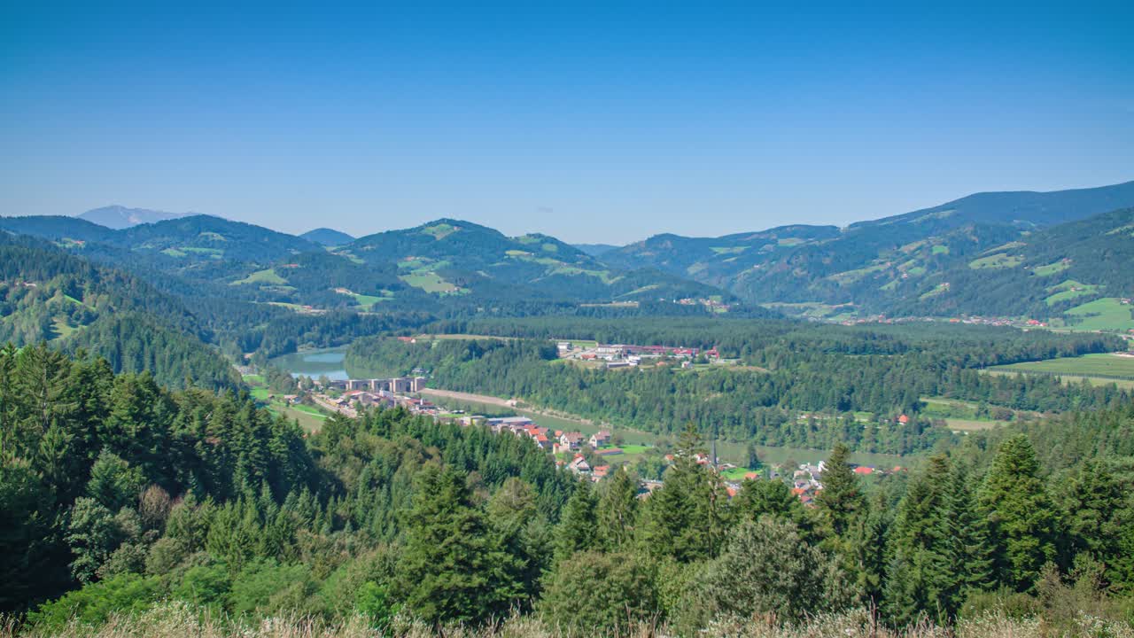 Aerial panoramic view over Vuzenica surrounded by hills, Slovenia