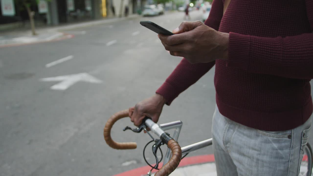 Mature man tapping phone to check updates, causing social badges animating around phone then fading
