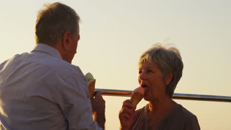 senior couple having ice cream at promenade 4k