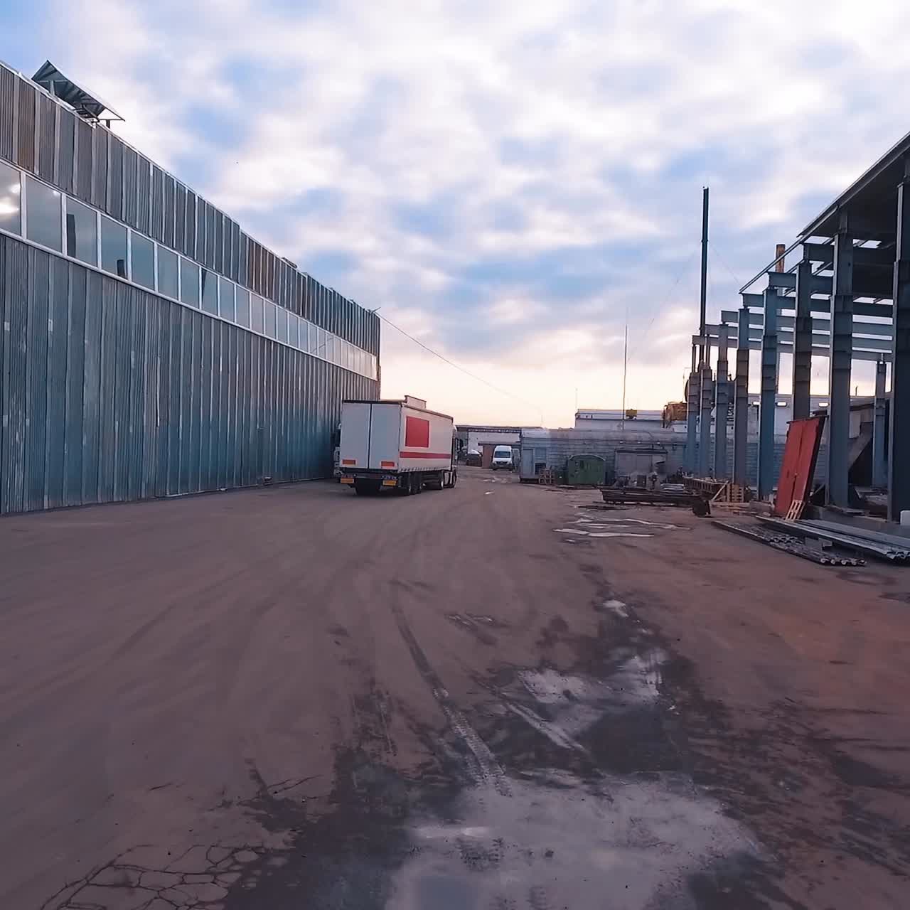 Cargo truck at warehouse building