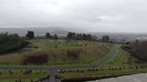 panning shot of the graveyard within stirling castle on a foggy day