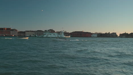 venetian canal scenery with ferry and boat