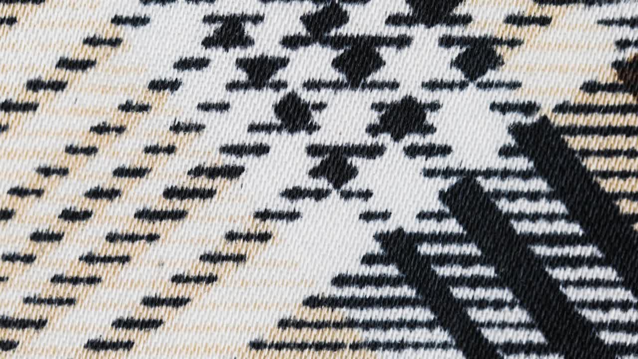 primer plano de imágenes giratorias de tela a cuadros.