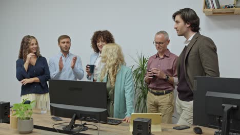 team of coworkers discussing business in office
